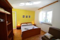Postel nebo postele na pokoji v ubytování Apartments Šimić