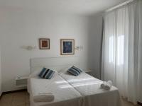 A bed or beds in a room at Apartamentos Vista Vedrá