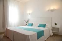 A bed or beds in a room at Apartamentos Vista Vedrá