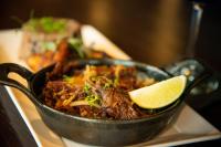 a pan of food with a lime wedge on it at Cambria Hotel Downtown Asheville in Asheville