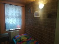 Postel nebo postele na pokoji v ubytování Dřevěnka