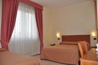 Łóżko lub łóżka w pokoju w obiekcie Hotel Belforte