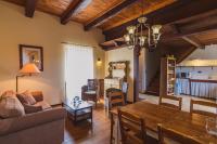 a living room with a couch and a table at Domaine Leyvinie, gite Mourvedre, close to the Dordogne in Perpezac-le-Blanc