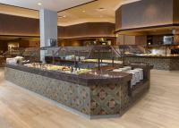 a restaurant with a counter with food on it at Riverside Casino & Golf Resort in Riverside