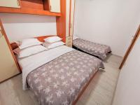 Posteľ alebo postele v izbe v ubytovaní Apartments Vukadin