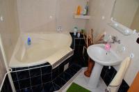 Kúpeľňa v ubytovaní Apartmány Riviéra a Chalupa Riviéra Liptov, Bešeňová