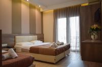 Posteľ alebo postele v izbe v ubytovaní Filippion Hotel