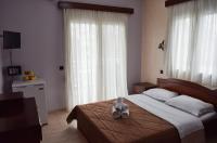Posteľ alebo postele v izbe v ubytovaní Filippion Hotel