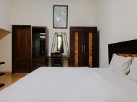 Hotel Mahkota Plengkung by ecommercelokaにあるベッド