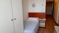 Łóżko lub łóżka w pokoju w obiekcie Hotel Tortorina