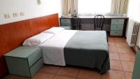 Łóżko lub łóżka w pokoju w obiekcie Hotel Tortorina