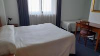 Łóżko lub łóżka w pokoju w obiekcie Hotel Tortorina