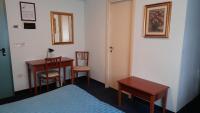 Łóżko lub łóżka w pokoju w obiekcie Hotel Tortorina