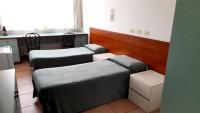 Łóżko lub łóżka w pokoju w obiekcie Hotel Tortorina