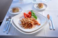 a plate of food on a table with plates of food at Gattopardo Park Hotel in Lipari