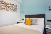 Postel nebo postele na pokoji v ubytování Faliraki Premium Hotel
