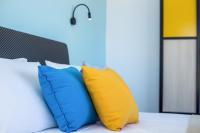 Postel nebo postele na pokoji v ubytování Faliraki Premium Hotel