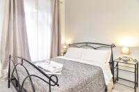 Postel nebo postele na pokoji v ubytování GuestHouse o Affittacamere Magenta Baylon Suite