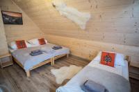 Posteľ alebo postele v izbe v ubytovaní Willa Mała Łąka Jacuzzi & Sauna