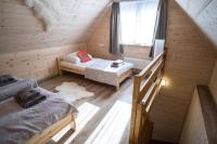Posteľ alebo postele v izbe v ubytovaní Willa Mała Łąka Jacuzzi & Sauna