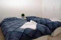 A bed or beds in a room at Maison Lux