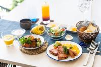 a table with plates of food on a table at Hotel Torifito Miyakojima Resort in Miyako Island