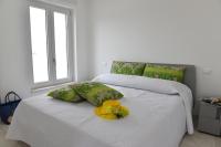 Posteľ alebo postele v izbe v ubytovaní Geranio Apartment - Villaggio di Mary