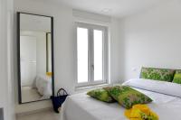Posteľ alebo postele v izbe v ubytovaní Geranio Apartment - Villaggio di Mary