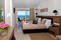 Postel nebo postele na pokoji v ubytování Hotel Yannis Corfu