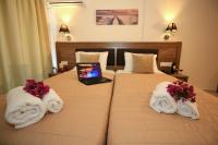 Postel nebo postele na pokoji v ubytování Hotel Yannis Corfu