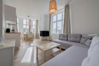 Televízia a/alebo spoločenská miestnosť v ubytovaní DR Apartments - Fryderyk