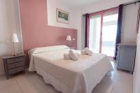 A bed or beds in a room at Apartamentos Nuevo México M 54