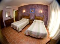 Posteľ alebo postele v izbe v ubytovaní Hotel Rural El Arriero