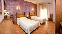 Posteľ alebo postele v izbe v ubytovaní Hotel Rural El Arriero