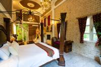 a bedroom with a large bed in a brick wall at Xin Yuan My Dream Castle in Dongshan