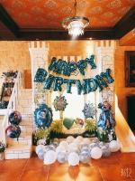 a christmas party with a happy birthday sign and balloons at Xin Yuan My Dream Castle in Dongshan