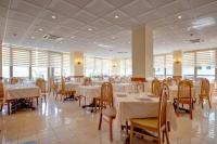 Reštaurácia alebo iné gastronomické zariadenie v ubytovaní Hotel Jalisco