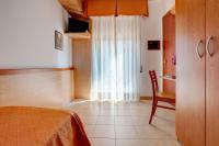 Posteľ alebo postele v izbe v ubytovaní Hotel Jalisco