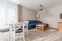 TV a/nebo společenská místnost v ubytování Resort Apartamenty Klifowa Rewal 41