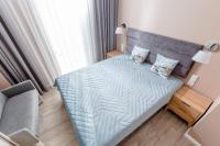 Postel nebo postele na pokoji v ubytování Resort Apartamenty Klifowa Rewal 41