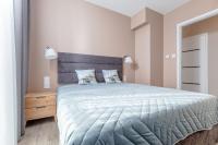 Postel nebo postele na pokoji v ubytování Resort Apartamenty Klifowa Rewal 41