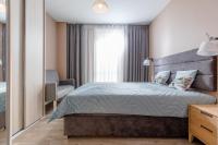 Postel nebo postele na pokoji v ubytování Resort Apartamenty Klifowa Rewal 41