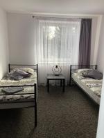 Łóżko lub łóżka w pokoju w obiekcie Apartament i pokoje Szalawa