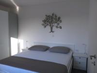 Postel nebo postele na pokoji v ubytování Apartments Rea