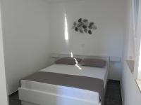 Postel nebo postele na pokoji v ubytování Apartments Rea