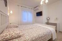 Postel nebo postele na pokoji v ubytování APARTMANI Mirona - Tučepi