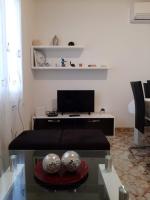 Televízia a/alebo spoločenská miestnosť v ubytovaní Apartment Summer Dreams
