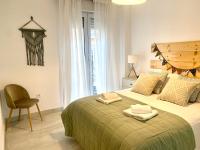 Posteľ alebo postele v izbe v ubytovaní Homely Málaga Larios
