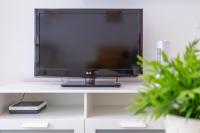 A television and/or entertainment centre at Flatguest Mary Sanchez