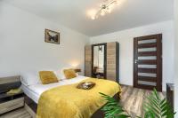 Łóżko lub łóżka w pokoju w obiekcie Apartament na Sportowej